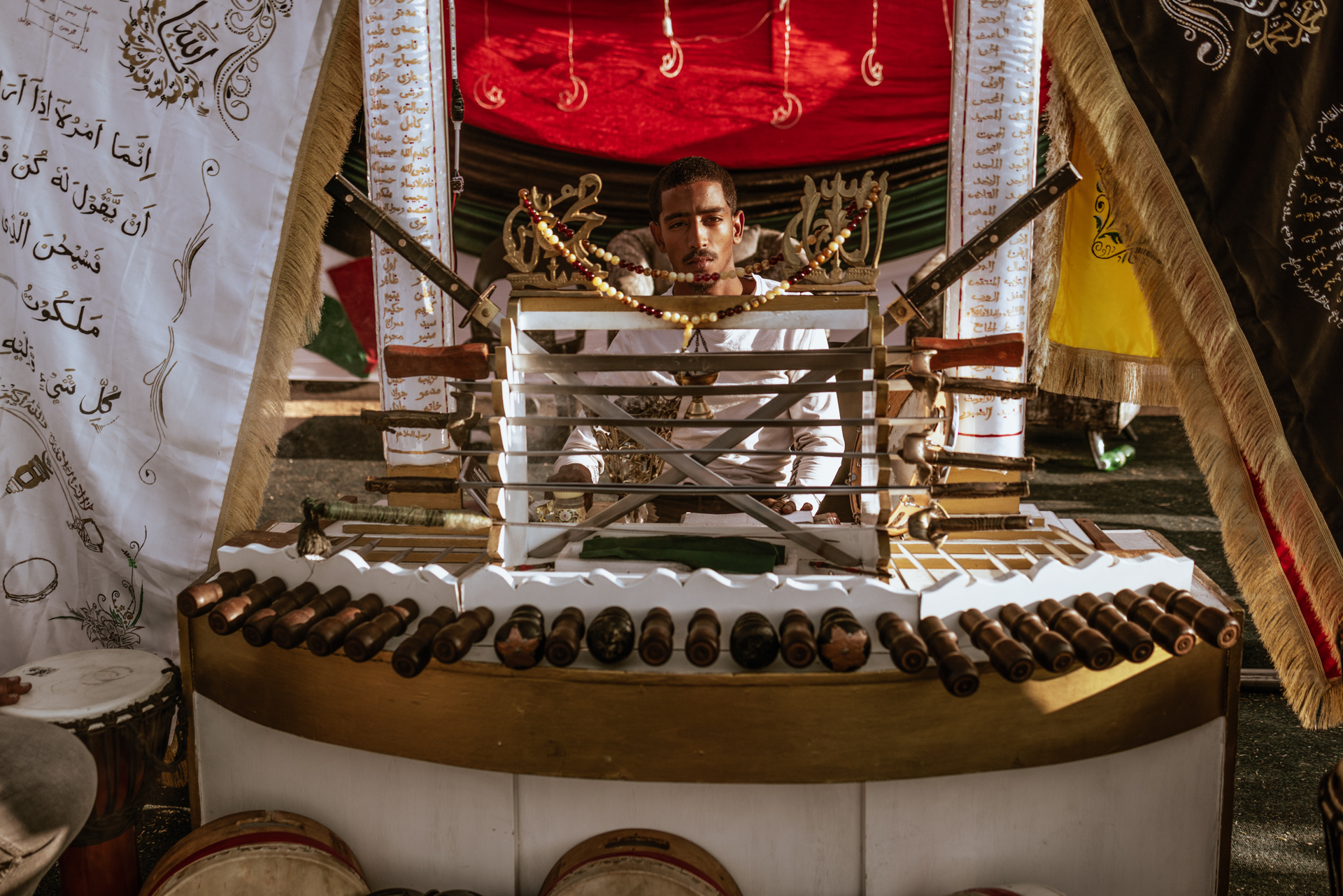 Omar Salie sits at the ornate Ratiep Bench which holds