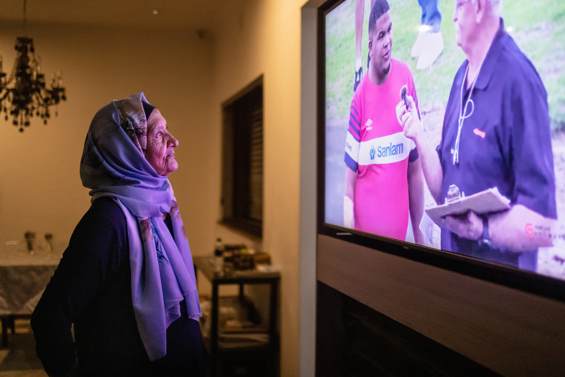 My grand-aunt Aziza Tyer watches a live rugby match being